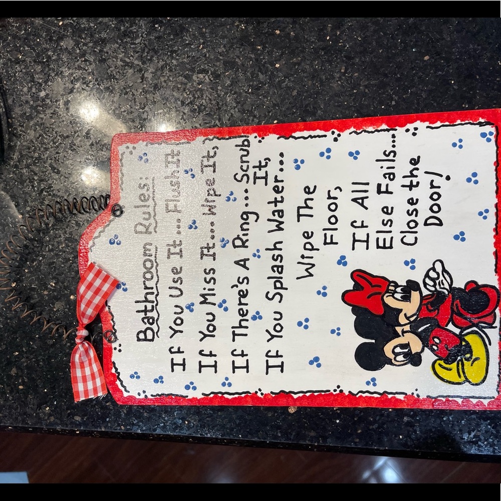 Disney bathroom sign